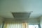 Large square return air vent located in the ceiling of a home.