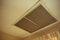 Large square return air vent located in the ceiling of a home.