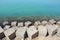 Large square stones breakwaters on seashore of Red Sea