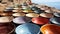 Large stack of pottery bowls in vibrant colors, ornate decoration generated by AI