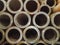 Large stack of thick-walled steel pipes for building structures