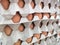 Large stacks of raw brown eggs, in large cardboard trays, and all ready for use in the kitchen.