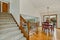 Large staircase with view of living room and dining room