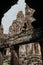 Large statues carved in rocks, portals and structures in the ruins of the Bayon temple in Ankgor Thom, Cambodia - UNESCO World