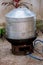 Large steamer, cooking equipment. Hot steamer pot and boiling water on charcoal stove or brazier.