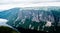 Large steep cliffs and plateau forming fjord under overcast sky