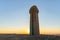 A large  stone sundial stands in a public sculpture park in the desert, on a cliff above the Judean Desert near Mitzpe Ramon,