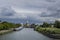 Large stone windmill on a canal in Schiedam, Holland