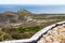 Large stones resting on a ledge in Cape Point. Perch overlooking the ocean.