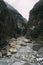 Large stony river bed cutting through huge, steep cliffs in Taroko National Park