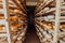 A large storehouse of manufactured cheese standing on the shelves ready to be transported to markets