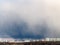 Large storm cloud over apartment houses in spring