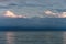 Large storm clouds on the Azov Sea, illuminated by the setting sun, the sea horizon.