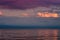 Large storm clouds on the Azov Sea, illuminated by the setting sun, the sea horizon.