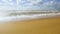 Large storm waves break about sand