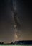 Large straw alpacas field under the Milky Way