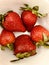 large strawberries in a white plate