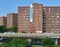 A large Stuytown banner is attached to the facade of one of the red brick residential towers in Stuyvesant Town, Manhattan, NYC