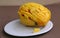 Large sugar tropical mango fruit with no skin ready to eat on white plate look sideways