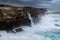 Large swells batter the cliffs of Sydney