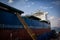 A large tanker kargo ship is being renovated and painted in shipyard dry dock