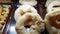 Large tapioca flour donuts being displayed at a Brazilian bakery showcase