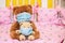 large teddy bear in protective mask and small teddy bear in medical mask sit in cot. Sick animals during epidemic. Coronovirus,