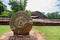 Large Thammachak carved stone, Dvaravati period art, located in Si Thep Historical Park, Phetchabun, Thailand