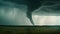 a large tornado is seen in the sky over a field