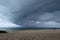 Large tornado on wide blue sea horizon