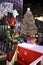 A Large toy nutcracker drummer statue and the holiday lights in Rockefeller Center