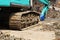 Large tracked excavator ,Excavator tractor pours the soil with Construction workers and construction engineer wearing safety