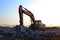 Large tracked excavator works in a gravel pit. Loading of stone and rubble for its processing at a concrete factory