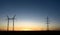 Large transmission towers at sunset