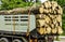 Large truck transporting wood. Wagons laden with wood of logs to the log yard at a lumber processing mill that specializes.