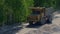 A large truck transports ore at an industrial plant