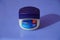 A large tub of Vaseline petroleum jelly isolated blue background. : A jar of Petroleum jelly which is used as over the counter