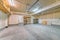 Large unfinished garage interior with wall patch marks