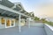 Large upstairs deck in southern California home with lattice covering at twilight