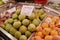 A large variety of fresh TROPICAL fruits on the counter of the grocery market