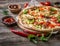 Large vegeterian pizza with sauces and pepper