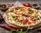 Large vegeterian pizza with sauces and pepper