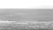 Large view of the sea revealed by a paint brush sweeping the screen. White space for text - useful as background.