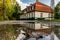 Large villa house near a large pond and forest