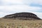 Large volcanic hill pops out of the sagebrush