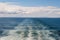 Large wake on open ocean left by a large ferry boat
