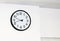 Large wall clock with white face and black border