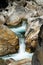 A large waterfall over a rocky cliff at Verzasca valley in Siwtzerland