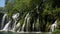 Large waterfall in the Plitvice Lakes National Park in Croatia. The Korana River, caused travertine barriers to form