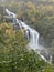 Large waterfalls flowing down to the fjords in autumn in Norway